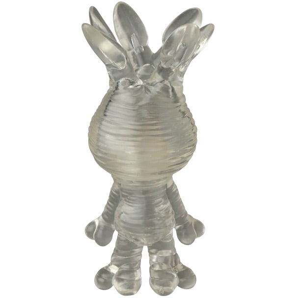The Medicom VAG 46 — Mandoraguraki is a translucent, textured figurine inspired by Japanese vinyl toys, with an oval body, rounded limbs, and several elongated head projections, shown from the front.