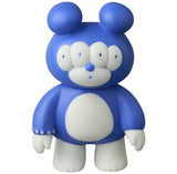 The VAG 46 — Matthew by Medicom is a blue and white bear-like figure with four eyes, round ears, and short limbs, standing upright against a plain background—a Japanese vinyl collectible reminiscent of gachapon toys.
