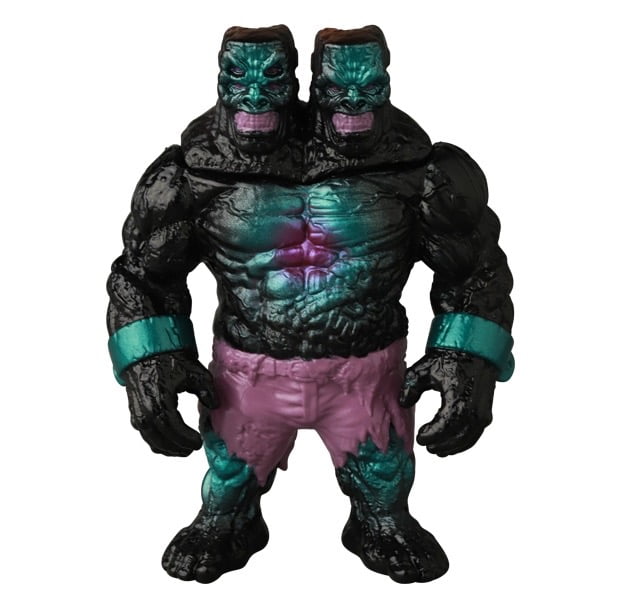 The VAG 46 — Giant Gorilla Franken Mini by Medicom is a two-headed, dark-skinned muscular action figure with teal highlights and purple shorts, inspired by Japanese vinyl toys—ideal for gachapon fans and collectors of the Vinyl Artist Gacha series.
