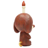 Keep Balance by How2Work (HK) shows a brown meditation pup figurine with a small golden tail seen from the back, featuring a candle with a red flame on its head.