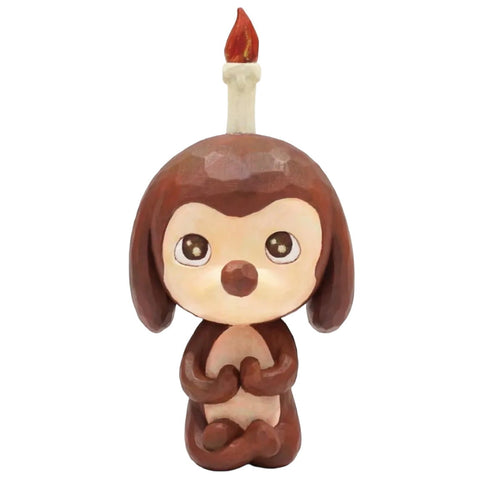 Keep Balance by How2Work (HK) is a small, brown, cartoon animal figurine with a candle and flame on its head, sitting upright—an adorable meditation pup and ideal balance decor for any space.