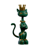 King Kat — Marble Majesty by Kaleidos Creative: a stylized green cat figurine with gold stripes, crown, and necklace stands upright with crossed arms on a white background—vintage Vegas glam in feline form.