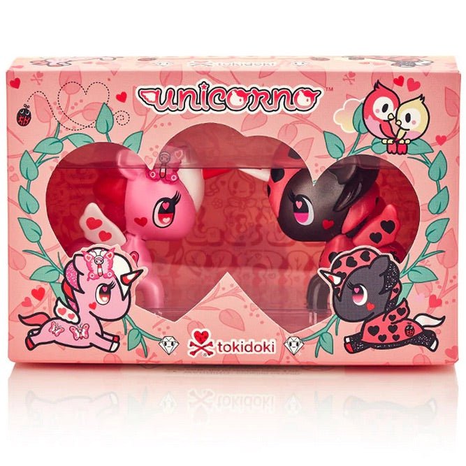 Two pink and black unicorns in a box, designed by tokidoki's Unicorno Love Bugs 2-Pack.