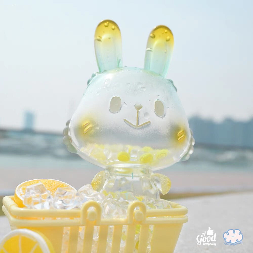 The Lemon Soda Robin by A Good Company (HK) is a translucent figurine with yellow-tinted ears, sitting in a cart filled with ice cubes and lemon slices—perfect as a charming home decor shelf ornament.