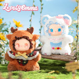 Two Lovely Emma — Pocket Zoo Blind Box plush toys, one dressed as a reindeer and the other as a white bear with blue ruffles, sitting on a wooden swing.