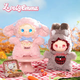 A pink lamb and grey bunny from the Lovely Emma — Pocket Zoo Blind Box collection sit on a red and white checkered picnic blanket with a miniature picnic basket.