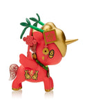 Introducing the Tokidoki Lucky Unicorno Blind Box: a red and gold figurine featuring decorative elements such as antlers, a clover, and the number 8 symbol. Each piece is packaged in a blind box, bringing surprise and good fortune to your collection.