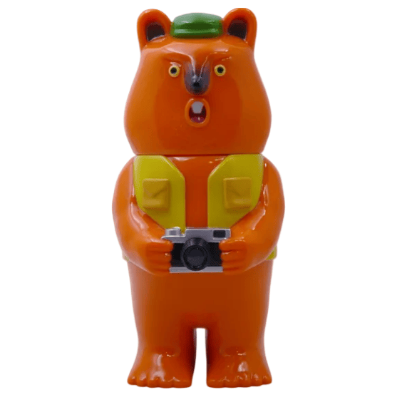 The Mamechan - #1 collectible figurine by Paradise Toy (TW) features an orange bear in a green hat and yellow vest holding a camera, displayed against a white background.