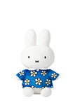 The Smoko Miffy Blue Daisy Midi Mochi Plush is a kawaii white bunny with upright ears, dressed in a blue outfit with white and yellow flowers, sitting facing forward against a plain white background.