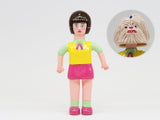 About Animals Shizuka/Maltese — Series 3 by Paradise Toy: a plastic doll with bob haircut, green top, yellow vest, and pink skirt. Inset shows her head removed, revealing a second monster-like face underneath.