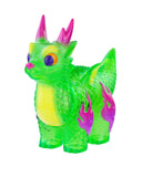The Rotofugi Ryudora- Tropical mini figure features green and yellow textured scales, purple flames on its legs, and pink horns, displayed against a white background.