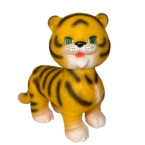 Stripes The Friendly Tiger by Bitter Squeaks (US) is a plastic toy tiger with yellow fur, black stripes, green eyes, and white paws, shown standing forward against a white background.
