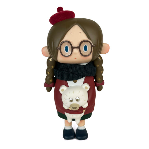 The toy is the Luna — Winter figurine by How2Work (HK), featuring a girl with glasses, brown hair, a red beret, scarf, and holding a white bear plush.