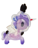 A whimsical, cartoon-style unicorn toy from tokidoki’s After Dark Skeleton Unicorno Blind Box collection, featuring a purple translucent body, red horn, black ears, clear wings, and playful design elements.