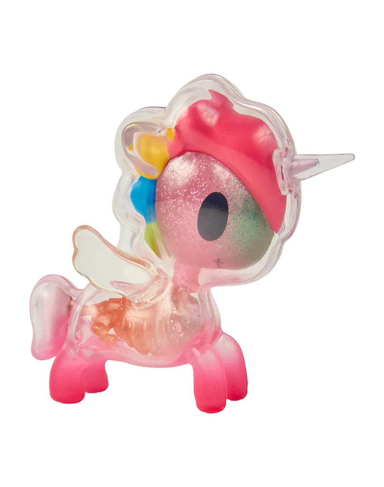A translucent pink unicorn figurine from tokidoki’s After Dark Skeleton Unicorno Blind Box collection, showcasing a glittery head, a single horn, white wings, and colorful accents in its mane, viewed from the side.