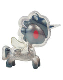 Introducing the After Dark Skeleton Unicorno Blind Box by tokidoki—a translucent vinyl figurine inspired by the Skeleton Unicorno series. Featuring a blue mane, large red eye, silver horn, and small white wings, its semi-transparent body reveals intricate inner details for a unique and whimsical style that echoes classic Blind Box collectibles.