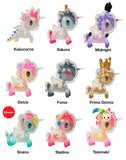Nine vibrant After Dark Skeleton Unicorno Blind Box figurines from tokidoki are arranged in three rows. Each Unicorno features a unique after-dark skeleton-themed design and is individually named—Kaijucorno, Sakura, Midnight, Dolce, Fumo, Prima Donna, Sirena, Stellina, and Tokimeki. Ideal for Blind Box collectors and fans of Skeleton Unicorno designs!.