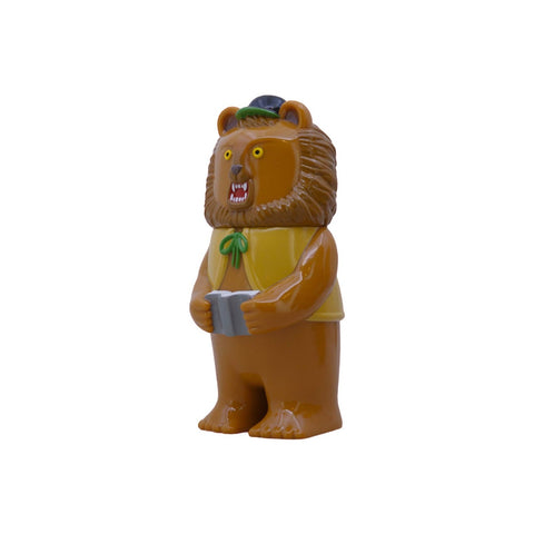 Morichan-Milktea by Rotofugi is a plastic toy lion figure in milktea color, upright with a yellow vest, green bow tie, black hat, and holding a gray book, shown against a white background.