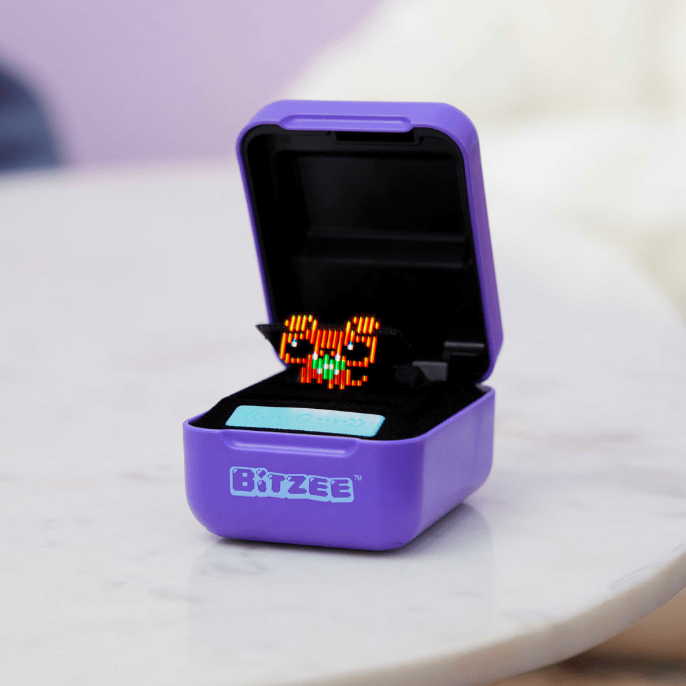 A purple box with a Bitzee - Interactive Digital Pet inside by Spinmaster.
