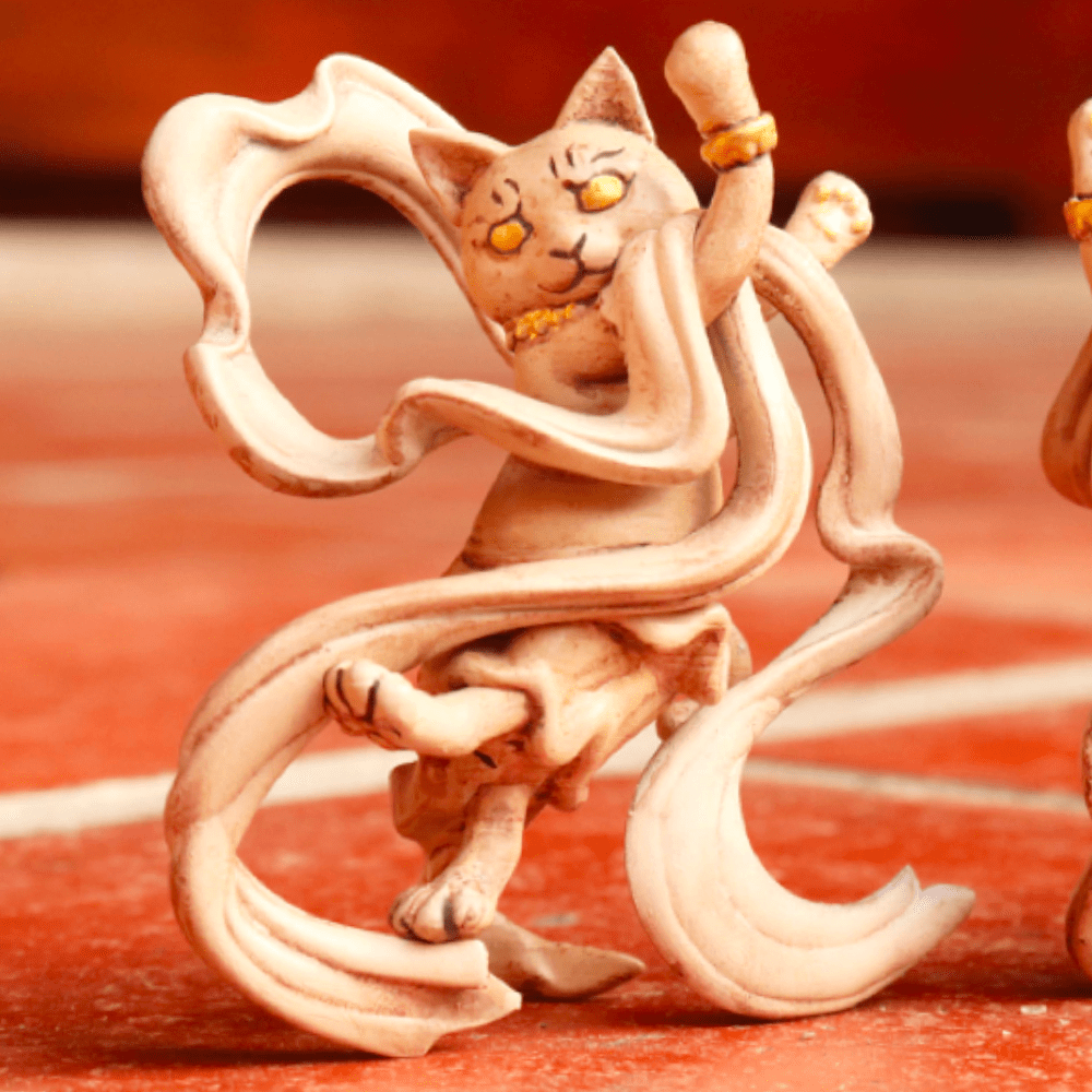 Two HitenNeko Flying Cat figurines from Partner Toys sitting on a tiled floor.