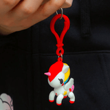 A person holding a Tokidoki Characters series 1 Blind Bag Clip with a unicorn on it from tokidoki.