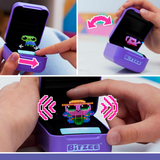 A person is holding a purple Bitzee - Interactive Digital Pet ring with a pixel on it that is touch-sensitive.