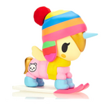 A Tokidoki Winter Wonderland Unicorno blind box featuring a toy unicorn wearing a hat and mittens.