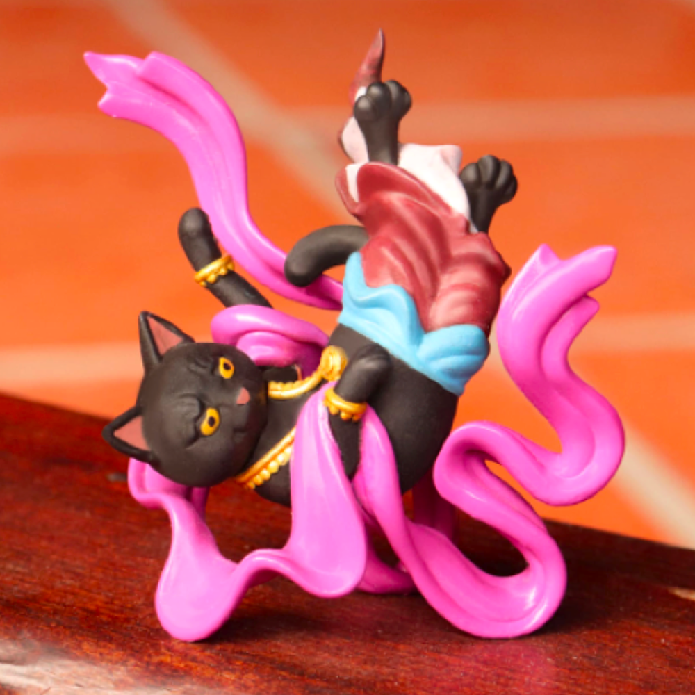 A figurine of a HitenNeko Flying Cat with a pink tail, showing vibrant colors by Partner Toys.