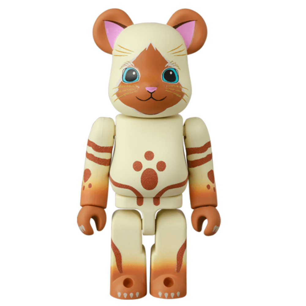 This charming Be@rbrick Series 49 Blind Box by Medicom features a cat-like toy bear with cream and brown hues, large blue eyes, and a gentle smile. Each purchase offers an element of surprise.