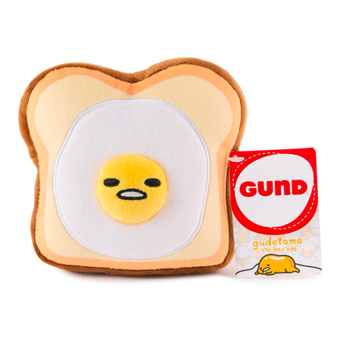 The Gund (US) Gudetama Egg Toast 5" Plush is a cute, cuddly toy shaped like toast with an egg design. Perfect for collections, it brings breakfast-themed whimsy and quirky comfort to fans.