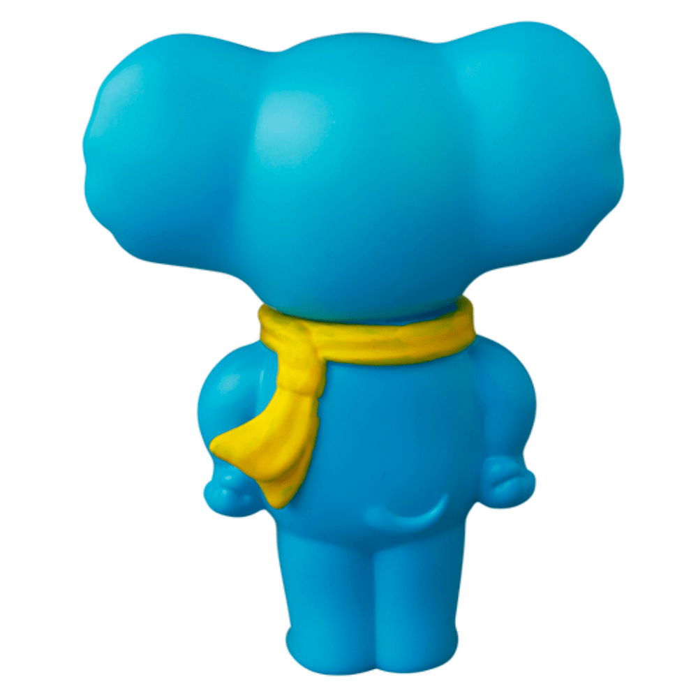 The VAG 43 — ZOU by Medicom (JP) is a blue cartoon elephant vinyl figurine facing away, adorned with a yellow scarf—a delightful collectible inspired by Japanese Vinyl Artist Gacha.