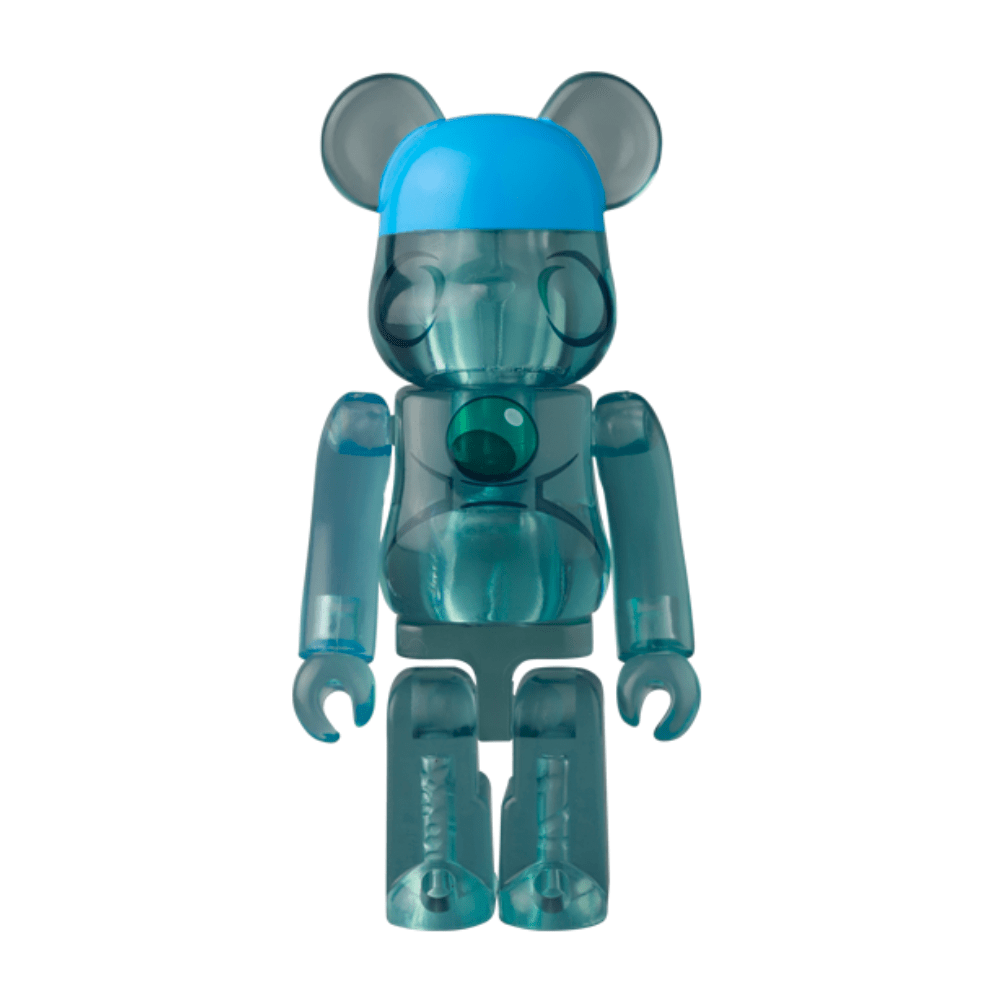 A translucent blue Be@rbrick Series 50 bear-shaped toy by Medicom (JP) stands upright with a blue cap and jointed limbs against a white background. This collectible comes in a blind box.