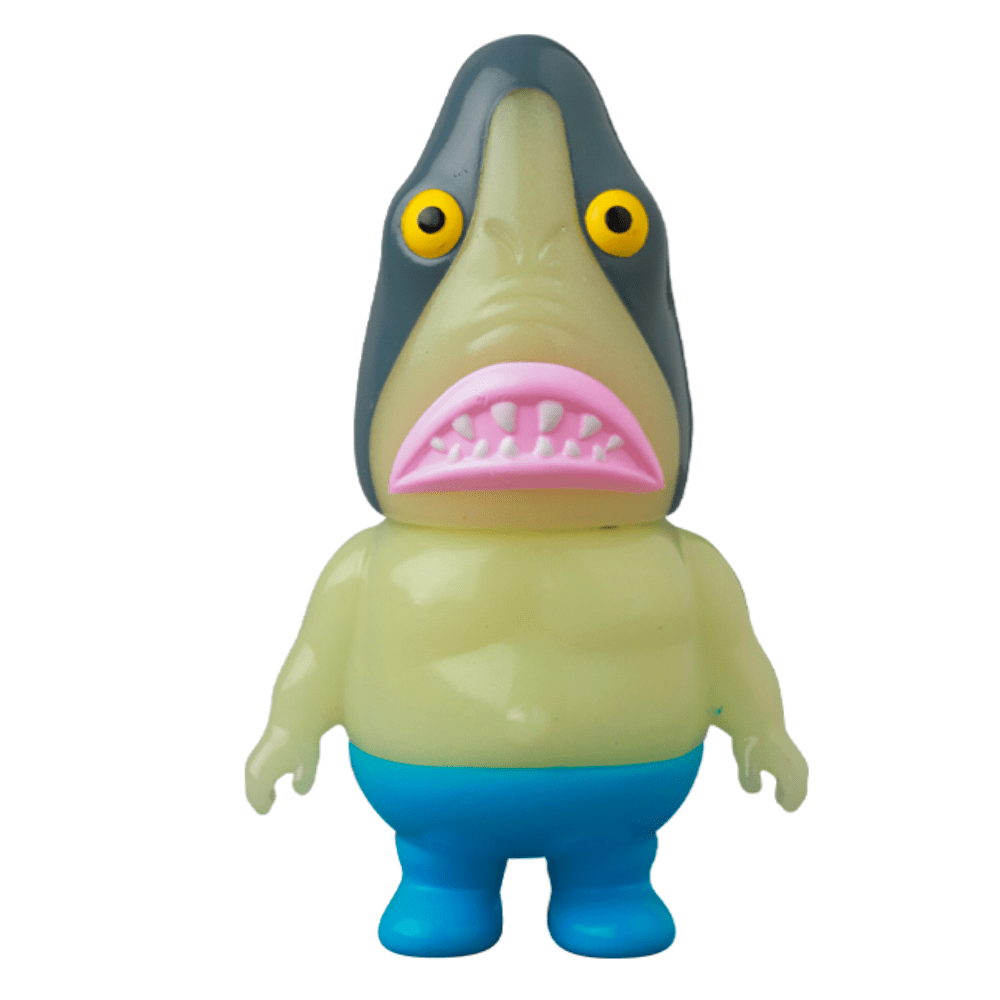A Vag 35 - Samen Chu toy shark with a yellow mouth sits on the shelf, adding a pop of color to the collector's life.