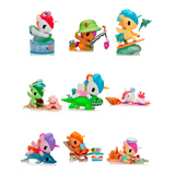 The Tokidoki Fun in the Sun Unicorno Blind Box by tokidoki (IT) features 10 colorful collectible animal figurines, each enjoying summer activities. Each box is a surprise, adding excitement to every unboxing!.
