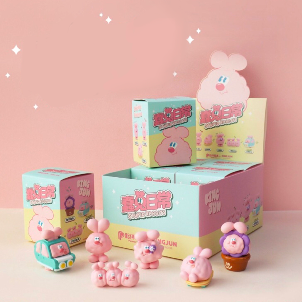 A Stupid Rabbits - Blind Box filled with cute pink toys, including rabbits.