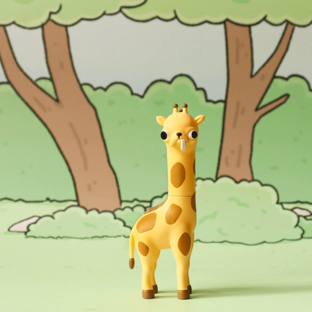 A Godgwawa — Weird Animals Blind Box toy by Partner Toys, featuring a large-eyed giraffe with a quirky design, stands on a green surface with cartoon trees and bushes in the background.