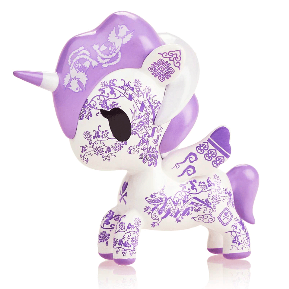 A decorative lavender and white TokiDoki Porcellana Unicorno figurine with intricate floral patterns, standing isolated on a white background.