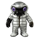 Medicom (JP) VAG 10th Anniversary — Cthuloid: A silver collectible inspired by Japanese vinyl toy design, featuring a puffy suit, oversized black gloves/boots, and a helmet with large purple eyes and a black beak-like mask.