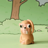 The Godgwawa — Weird Animals Blind Box by Partner Toys features a small monkey figure with big eyes and two teeth, inspired by the world’s strangest animals. It sits on a green surface with a forest backdrop—perfect for any blind box collection.