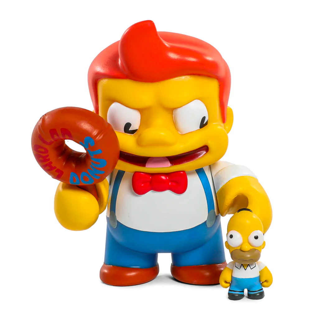 A cartoonish character with red hair and a bow tie holds a donut in one hand and a Simpsons Treehouse of Horrors Series 2 Blind Box figurine resembling a bald figure in a white shirt by Kidrobot (US) in the other.