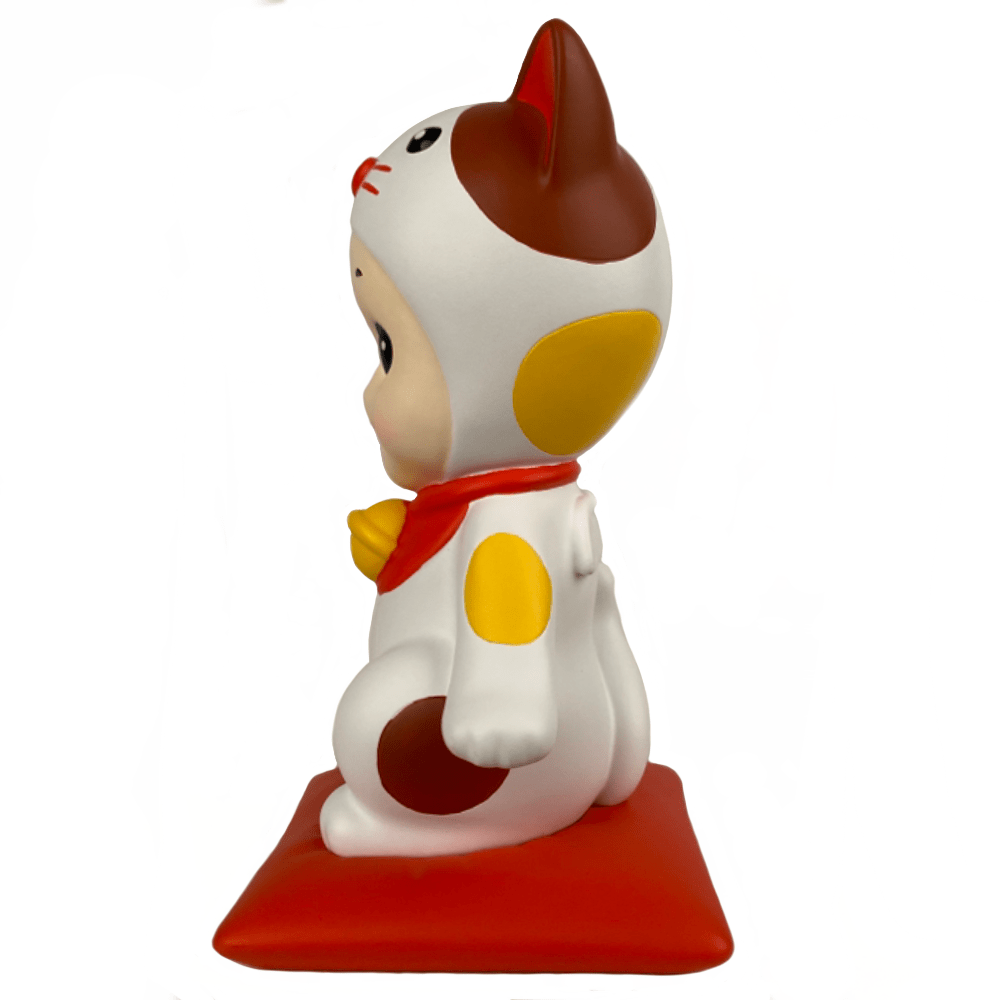 A Dreams Lucky Cat Collectors Trophy figurine sitting on a red base for your collection.