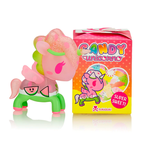 A small figurine of a pink unicorn with green accents and a watermelon-themed body stands next to a colorful box labeled "Tokidoki Candy Unicorno - Blind Box." This delightful piece is part of the tokidoki (IT) series, featuring vibrant candy and unicorn illustrations.