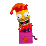 A yellow-skinned cartoon character with wide eyes and a red jester hat emerges from a whimsical purple jack-in-the-box with a star, echoing the playful design of Kidrobot's Simpsons Treehouse of Horrors Series 2 Blind Box figures.