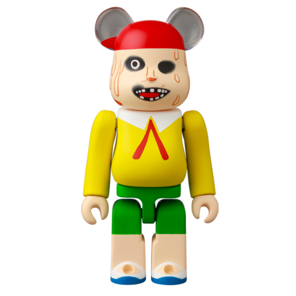 The Be@rbrick Series 49 Blind Box toy from Medicom (JP) sports a cartoonish face, red cap, black eye, yellow shirt with a red triangle, green shorts, and mouse-like ears—making it a delightful addition to any collection!.