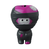 A small VAG 36 - Yummy Mummy figurine by Medicom (JP) resembling a wrapped mummy with pink and black coloring. The figure has large, round eyes peeking through the wrappings, capturing the charm of Japanese vinyl toys often found in gachapon machines.