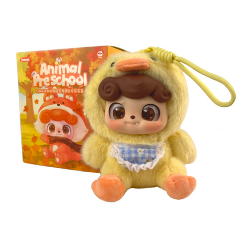 A plush toy in a duck costume is displayed before the vibrant autumn-themed Q.Kid Animal PreSchool Plush Blind Box by Jotoys, reminiscent of charming animal costumes for baby dolls.