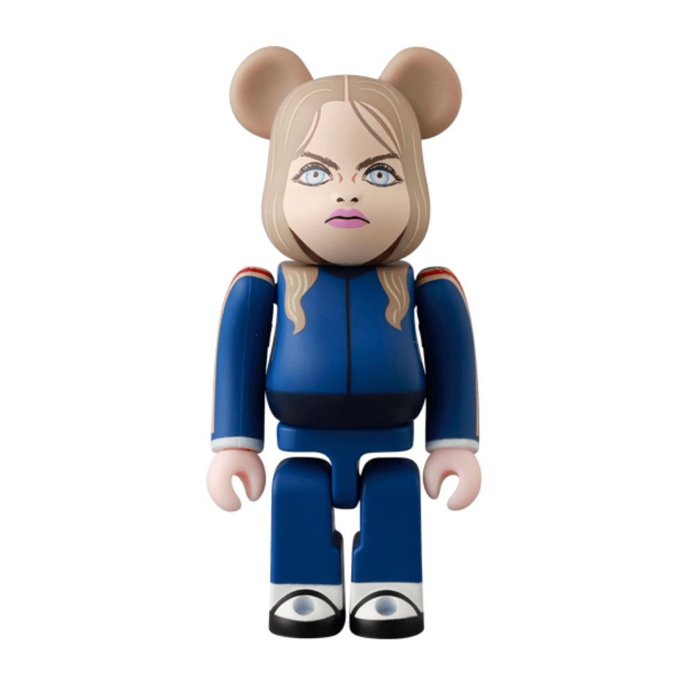 The Be@rbrick Series 50 Blind Box by Medicom (JP) features a collectible vinyl bear figurine with exaggerated facial features, long blonde hair, blue outfit, and silver shoes—each box offers a surprise character.