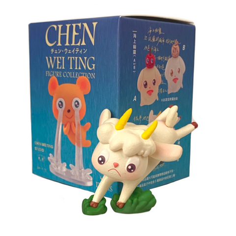 A figurine of a sheep by Chen Wei Ting in front of a Partner Toys (TW) Blind Box.