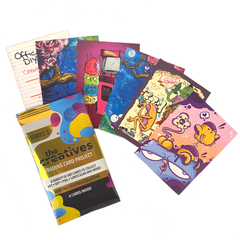 A pack of The Creatives Trading Card Project (Series 3) with a variety of cartoons on them, created by different artists.