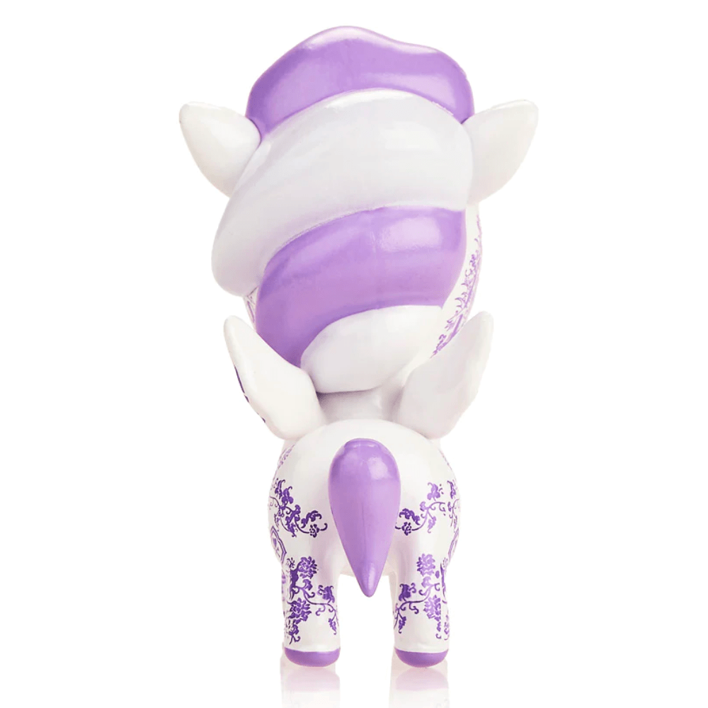 Rear view of a decorative lavender and white porcelain TokiDoki Porcellana Unicorno figurine with floral patterns, isolated on a white background.